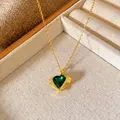 Detailed view of a gold heart necklace with a green gemstone and cubic zirconia accents. - Heart Wing Style (W052)