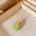 Detailed macro view of gold necklace with green stone pendant and zircon sun accent - Sunflower Pingan Buckle Style (W139)