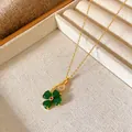 Detail shot of a New Chinese style four-leaf clover pendant necklace with green stones - Green Gem Four-Leaf Clover Style (W233)