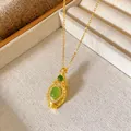 Detailed macro view of a vintage gold gourd pendant featuring elegant green zircon inlay - Vintage Light Luxury Gourd Style (W257)