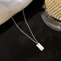 Collier minimaliste en acier inoxydable avec pendentif lettre initiale L couleur argent - Lettre L / Argent