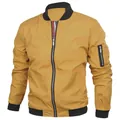 Detail of a yellow men's bomber jacket with black ribbed cuffs and utility sleeve pocket. - 6XL / Tops / Yellow