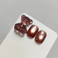 Cat eye gel nail polish in amber brown with 3D resin bear decoration - Reddish Brown Amber (XQ229-M)