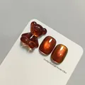 Reddish-brown cat-eye nail gel SKU with 3D translucent bear charm and glossy finish. - Reddish Brown Cat Eye (XQ230-M)