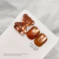 Amber cat eye nail gel polish featuring 3D bear decoration and glossy metallic finish. - Amber (XQ07-M) / Amber