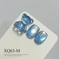 Professional shimmering blue cat eye nail gel polish with glass bead effect and bear charms - Light Blue Cat Eye (XQ63-M)