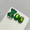Professional green cat-eye nail gel polish swatch with 3D resin bear nail art charm - Emerald Green Cat Eye Style (XQ139-M) / Verdant