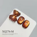 Amber cat eye magnetic nail charms with 3D gummy bear shape in golden brown. - Amber Bronze Cat Eye (XQ276-M)