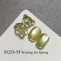 Premium olive green cat eye gel nail polish with translucent bear charm, SKU XQ26-M - Grass Green Cat Eye (XQ26-M) / Grass Green