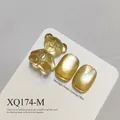 Professional golden cat eye nail gel polish variant showing cute bear charm detail - Light Gold Amber Cat Eye Style (XQ174-M)