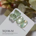 Light green cat-eye nail gel with shimmer moonlight effect and cute bear charm - Pale Green Cat Eye (XQ186-M)