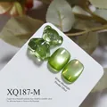 Green cat-eye nail gel samples with glass bear charm on white professional display card - Green Cat Eye (XQ187-M)