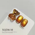 Golden amber cat-eye nail gel polish SKU XQ206-M featuring a cute 3D bear accessory - Amber Gold Brown Cat Eye (XQ206-M)