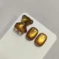 Professional golden yellow cat eye nail gel set with a cute 3D resin bear accessory - Amber Gold Cat Eye Style (XQ243-M)