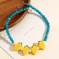 Collana di perle blu stile foresta con vivaci ciondoli a forma di limone giallo - Collana al Limone in Resina (6680)