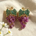 Exquisite vintage grape-shaped drop earrings featuring purple stone beads and green leaves - Purple Beaded Tassel Grape Cluster Earrings (2608172) / Purple