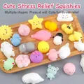 Assorted cute animal mochi squishy toys set on a wooden tray for stress relief - Animal Squishy (4cm) / Colorful