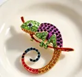Close-up detail of a colorful rhinestone chameleon brooch with vibrant enamel finish - Chameleon (X0395) / Purple