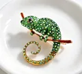 Detail shot of an elegant green chameleon brooch featuring colorful iridescent rhinestones - Chameleon (X0395) / Green
