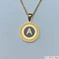 Detailed view of a gold stainless steel round pendant with letter A and rope border - Letter A Style (03) / 1 Piece