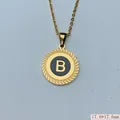 Close-up of a circular gold pendant with a black enamel center featuring the letter B. - Letter B Style (03) / 1 Piece