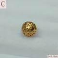 Detail of a 9mm gold-colored stainless steel hollow bead with heart-shaped cutouts - Heart Hollow Style (C) / 9*9.8mm / Gold (C)