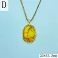 Macro view of a vintage oval amber resin pendant featuring an irregular gold frame. - 22*32.2mm / Oval Amber Texture Pendant (Style D)