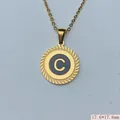 Detailed macro view of a gold stainless steel round pendant with initial C and rope edge - Letter C Style (03) / 1 Piece
