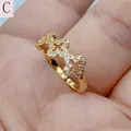 Detail view of a gold-plated open ring featuring cubic zirconia clover patterns. - Style C (Micro Inlaid Clover)