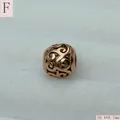 Macro detail of vintage rose gold stainless steel hollow filigree round spacer bead - Rose Gold (Style F)