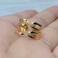 Detailed view of a gold-plated geometric hollow ring with micro-set zircon accents on hand. - Style G (Multi-Layer Geometric)