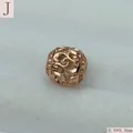 Macro detail of a rose gold hollow filigree bead measuring 9.8x9.8mm - Rose Gold (Style J)