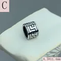 Detailed macro shot of retro stainless steel bead with engraved Greek key pattern - Greek Meander Pattern (C) / 8.3x11.4mm
