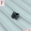 Close-up of antique silver stainless steel spacer bead with cross pattern, 6x8.4mm. - 6x8.4mm