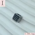 Detail view of a vintage textured square spacer bead for jewelry making, 7.7mm size. - 7.7x7.7mm