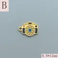Detailed view of a small golden camera charm pendant with colorful enamel accents - Vintage Colorful Camera Style (B) / 8.8x12mm