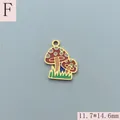 Detail view of a 11.7x14.6mm red enamel mushroom charm in gold-plated stainless steel. - Red And White Polka Dot Mushroom Duo Style (F)