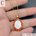 Macro detail of Our Lady of Guadalupe mother of pearl oval pendant with orange bead border - Red Coral Color Style (C)