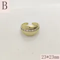 Macro view of a luxury gold-plated dome ring featuring sparkling baguette stones - Wide Rounded Rhinestone Pave Style (B) / 23x23mm / Gold