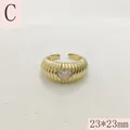 Detail view of gold ribbed ring with heart-shaped stone and open adjustable band - Croissant Texture Heart Rhinestone Style (C) / 23x23mm / Gold