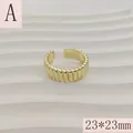 Close-up of gold croissant open ring featuring a ribbed pattern and 23*23mm size - Wavy Texture Style (A) / 23*23mm (Adjustable Open) / Gold