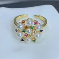 Close-up detail of a gold flower ring featuring white pearls and colorful zircons - Pearl Colorful Flower Open Style (A) / Gold