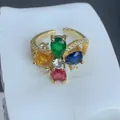 Close-up of vibrant multi-colored flower ring with sparkling zircon and gold-tone band - Mixed Zirconia Flower Open Style (B) / Gold