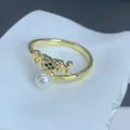 Close-up detail of a golden MOM ring featuring a white pearl and colorful zircon heart - MOM Letter Colorful Zirconia Heart Style