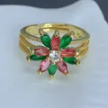 Macro detail of a gold flower ring featuring green and red marquise-cut zircon stones - Red Green Marquise Flower Open Style (C) / Gold