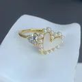 Detailed view of elegant gold heart ring with pearl border and sparkling zircon stone - Double Heart Shell Pearl Inlaid Style