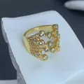 Detailed close-up of a gold-plated geometric butterfly ring with sparkling cubic zirconia - Hollow Butterfly Style