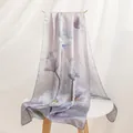 Elegant mulberry silk scarf with purple floral print displayed on a minimalist white table - Long / Fog Purple Water Lily / 55*170CM