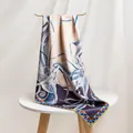 Detailed macro view of the 16mm twill mulberry silk scarf featuring elegant prints - 86x86 / Entwined Branches