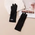 Elegant black silk sun protection gloves featuring delicate floral lace detailing for women - One Size / Black